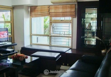 Living Room Comfortable 2BR Apartment at Grand Tropic Suites Apartment Low Floor