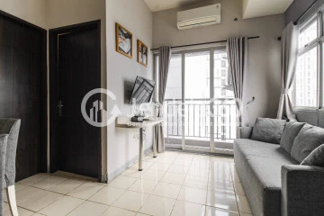 Living Room Family Friendly 2BR Apartment with City View at Serpong Green View Apartment