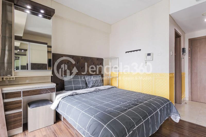 Bedroom Modest Studio Apartment with City View from Heights at Puri Orchard Apartment