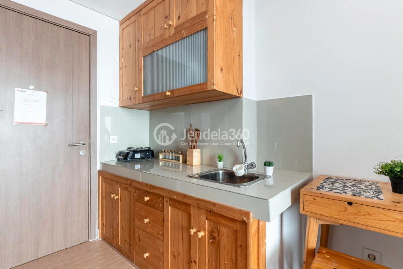 Kitchen Peaceful 1BR Apartment at Puri Orchard Apartment Low Floor