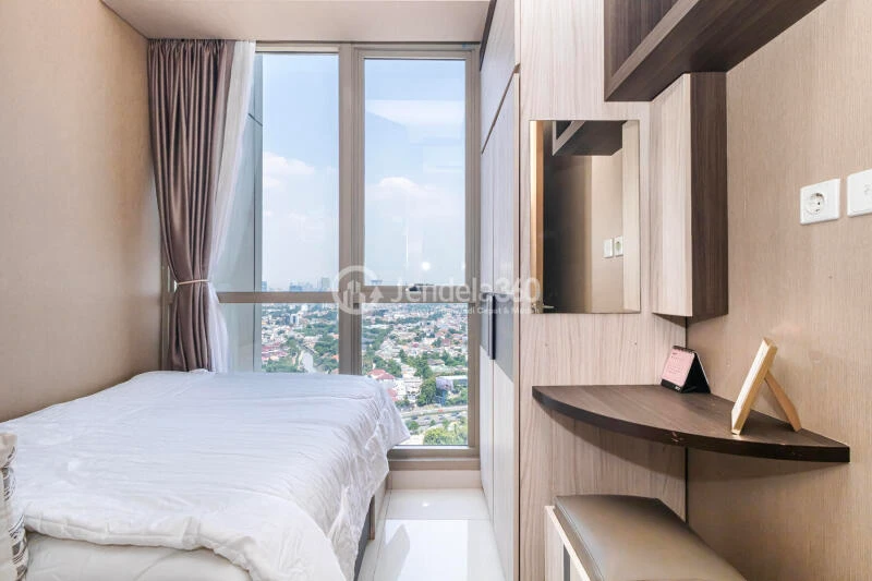 Bedroom 2 Relaxed 3BR Apartment Low Floor with City View at Taman Anggrek Residence