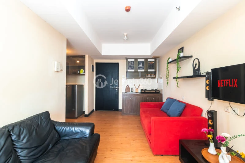 Living Room 1BR Apartment with City View at The Wave Apartment