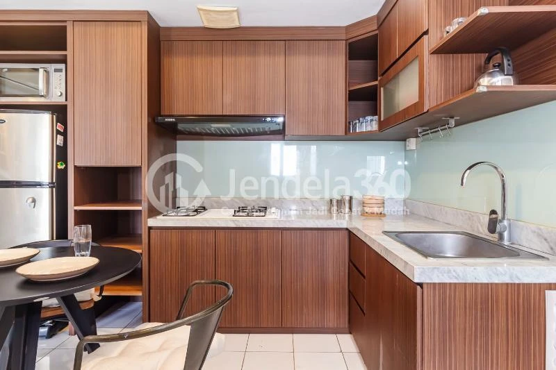 Kitchen Fancy 2BR Apartment at The Wave Apartment Tower Coral