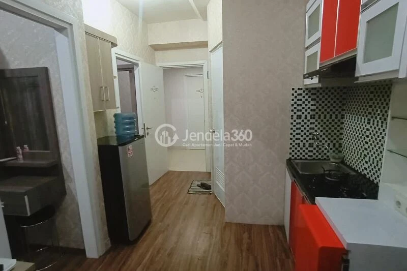 Living Room 2BR Green Pramuka City Apartment at Middle Floor