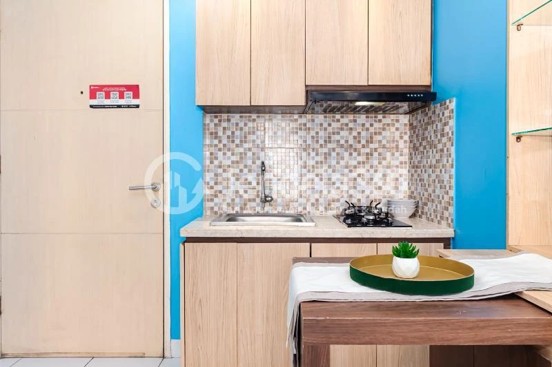 Kitchen Cozy 2BR Apartment Middle Floor with City View at Kota Ayodhya Apartment