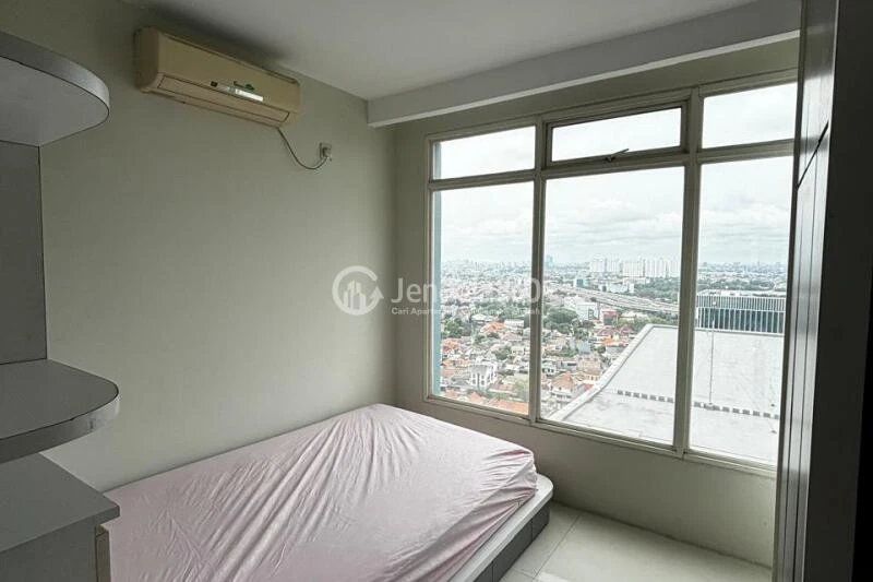 Bedroom 1 Restful 5BR Apartment High Floor with Whoosh Station View at Patria Park Apartment