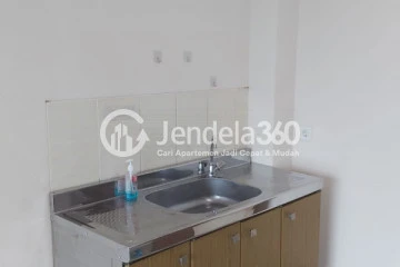 Kitchen Middle Floor 1BR Apartment with Pool View at Callia Apartment