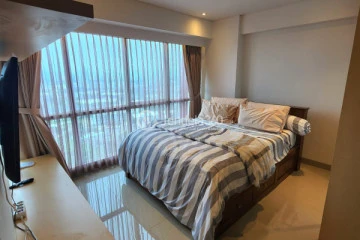 Bedroom 1 Tidy 2BR Apartment High Floor with City View at Callia Apartment