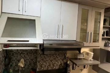 Kitchen Homey 1BR Apartment at Paragon Village Apartment Tower B