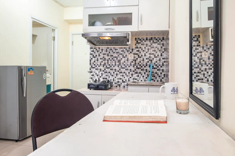 Kitchen Low Floor 2BR Apartment with Swimming Pool View at Green Pramuka City Apartment
