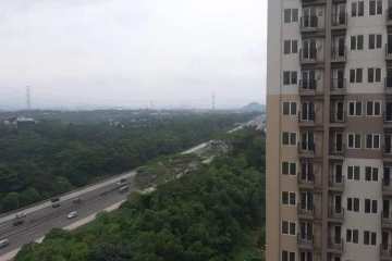 Balcony Studio Apartment with City View at Podomoro Golf View Apartment