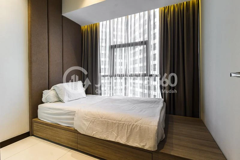 Bedroom 2 Restful 2BR Low Floor Apartment at Casa Grande Apartment