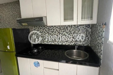 Kitchen Elegant Studio Apartment Middle Floor with City View at Kalibata City Apartment
