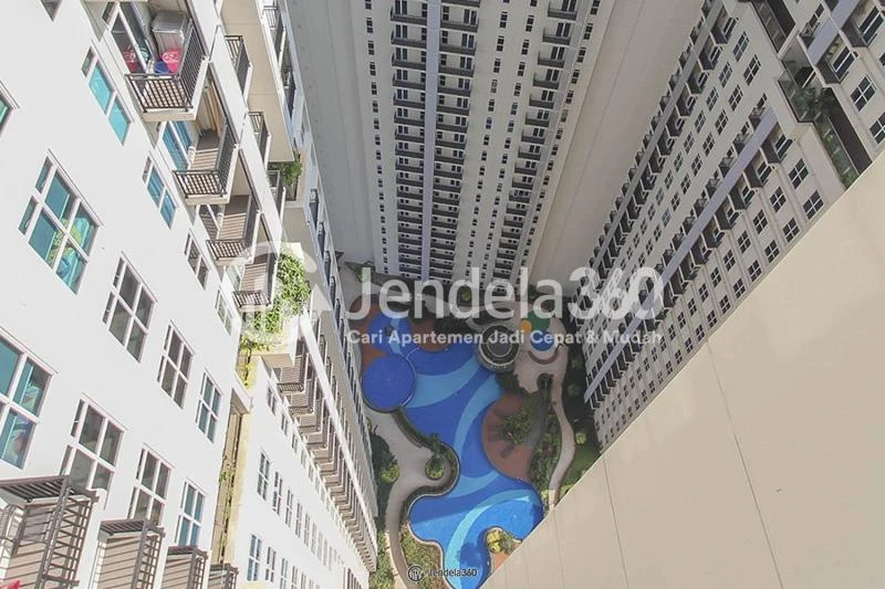 Balcony Restful Stduio Apartment with City View from The Top Floor at Puri Orchard Apartment