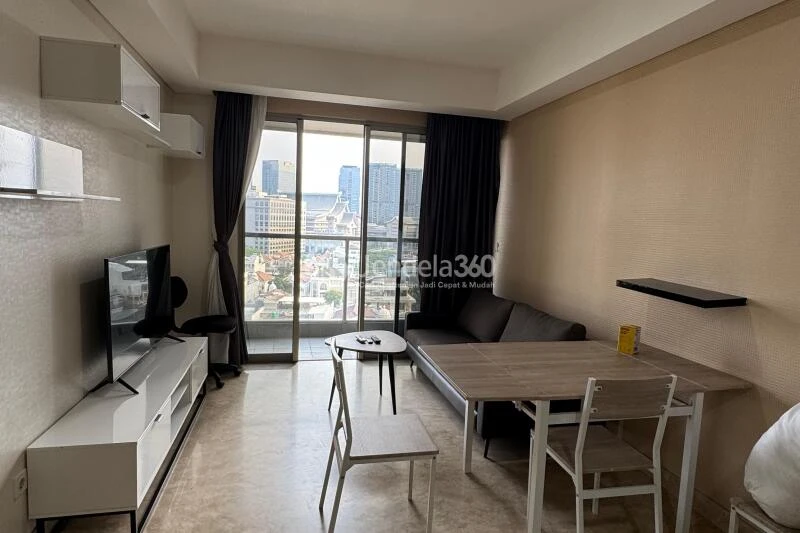Living Room Low Floor 1BR Apartment with City View at Gold Coast Apartment
