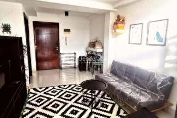 Living Room High Floor 1BR Apartment with City View at Neo Soho Residence