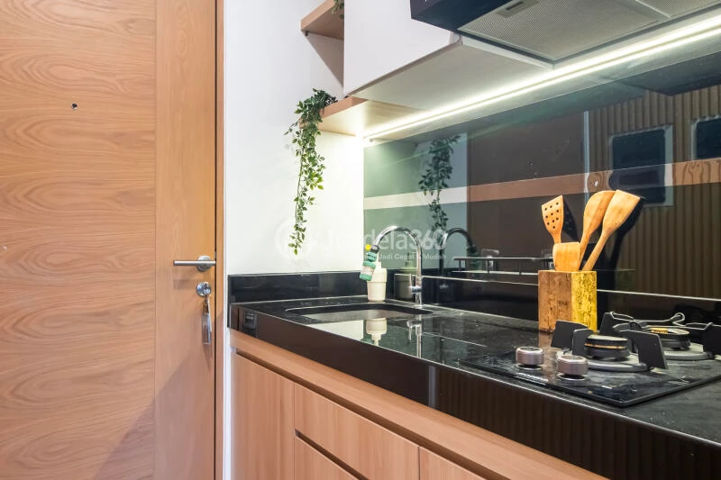 Kitchen Peaceful Studio Apartment Middle Floor with City View at The Newton 2 Ciputra Apartment