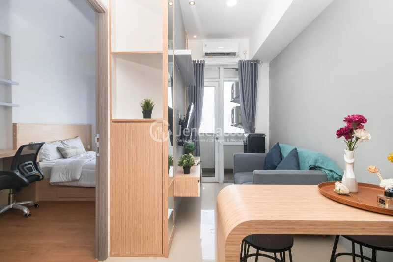 Living Room Strategic Location 1BR Apartment High Floor with City View at Vasanta Innopark Apartment