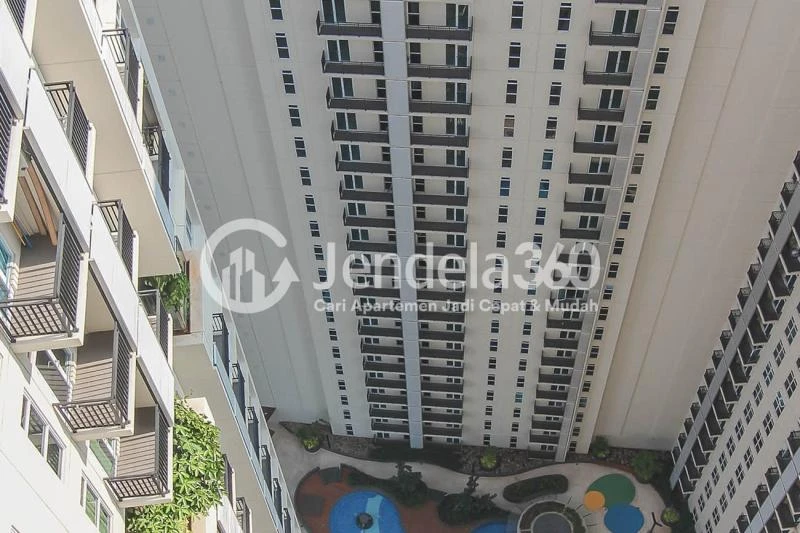 Balcony Restful Stduio Apartment with City View from The Top Floor at Puri Orchard Apartment