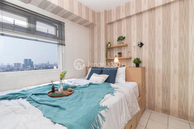 Bedroom 1 Relaxed 2BR Apartment Low Floor with  View at Green Pramuka City Apartment